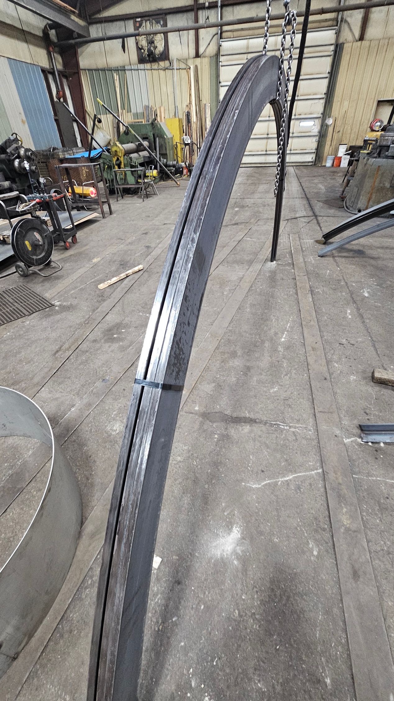 A close up of a metal pipe in a warehouse.