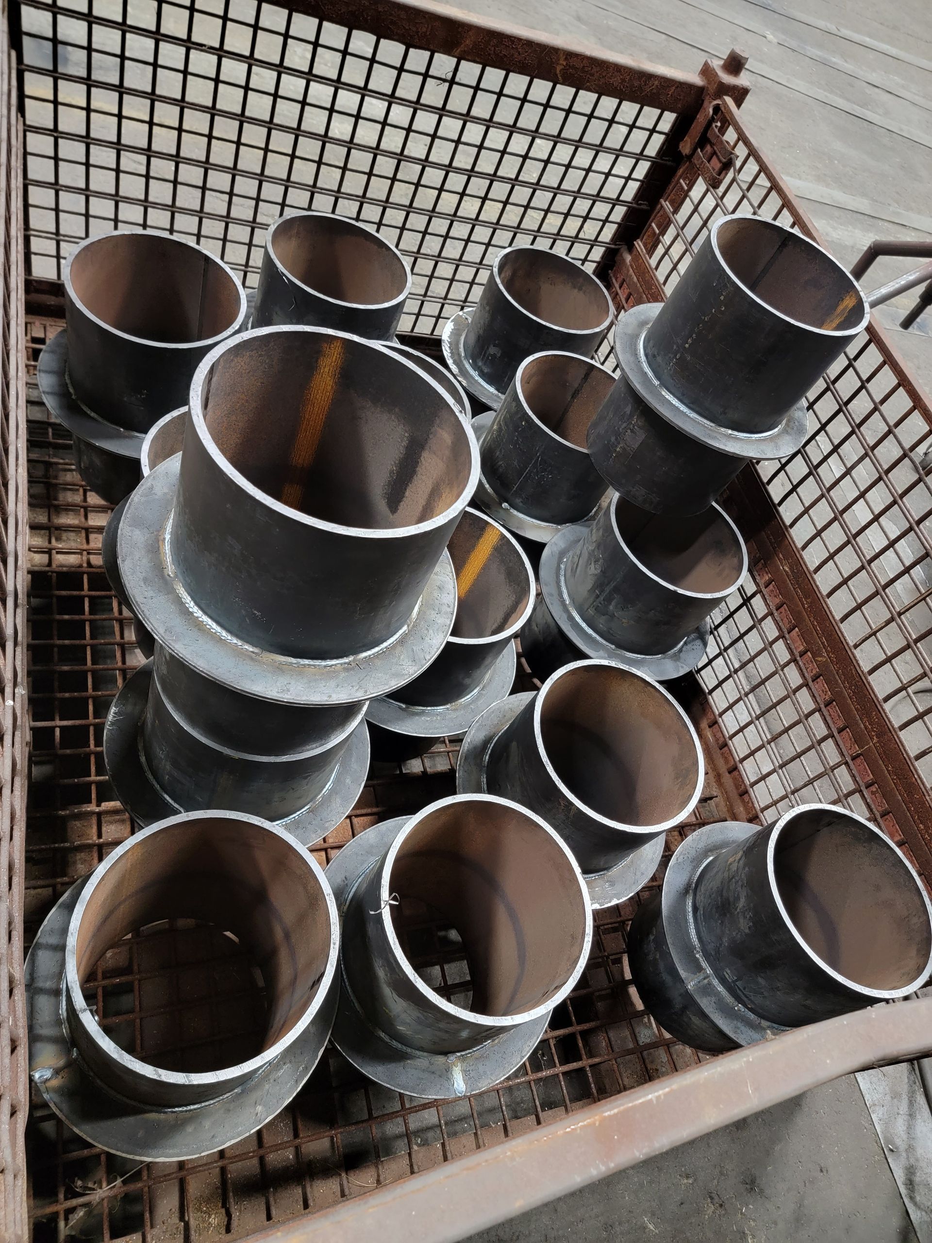 A bunch of metal pipes stacked on top of each other
