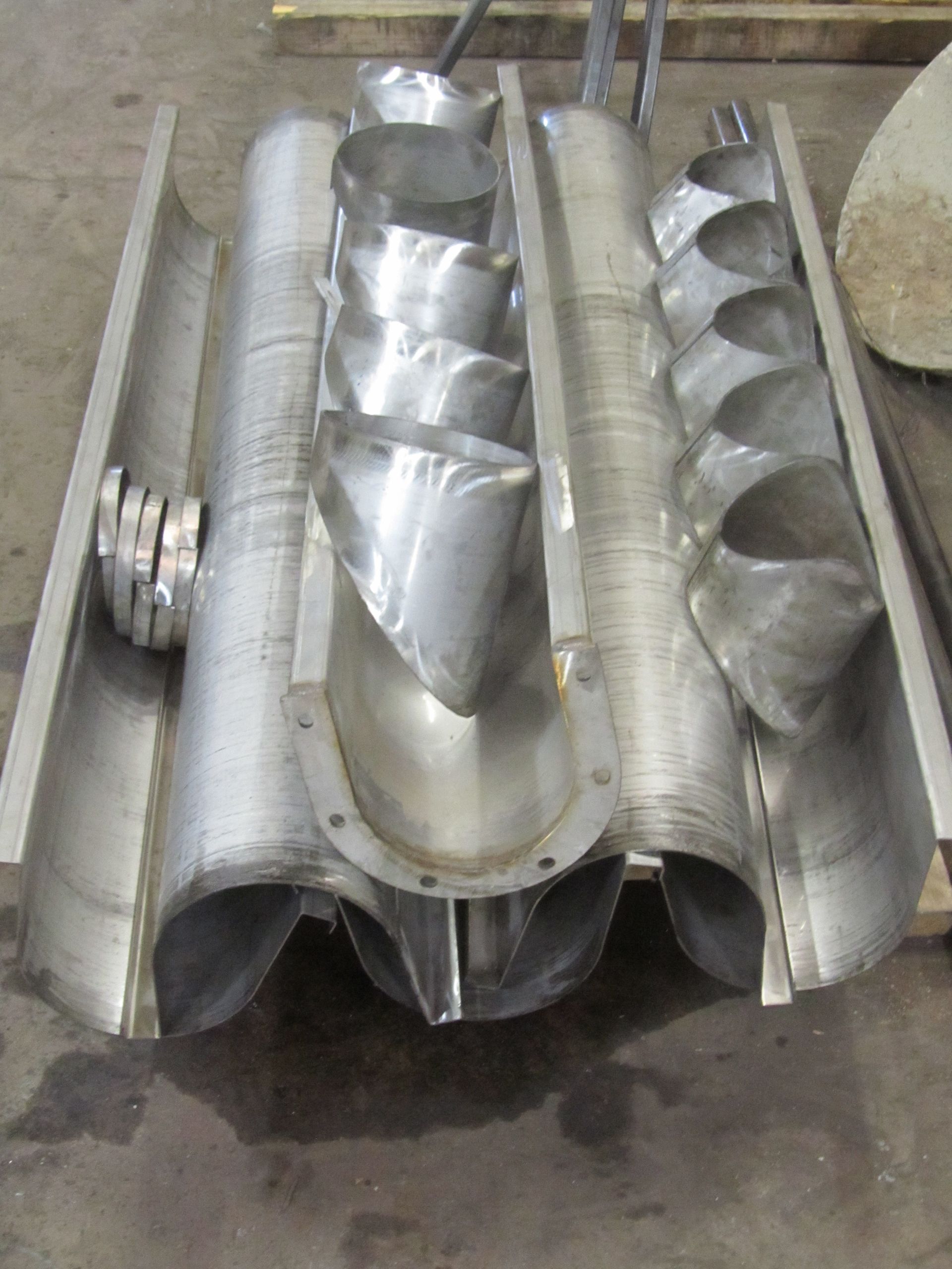 A bunch of metal pipes are stacked on top of each other