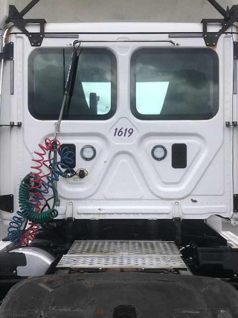 A white truck with the number 1619 on the back