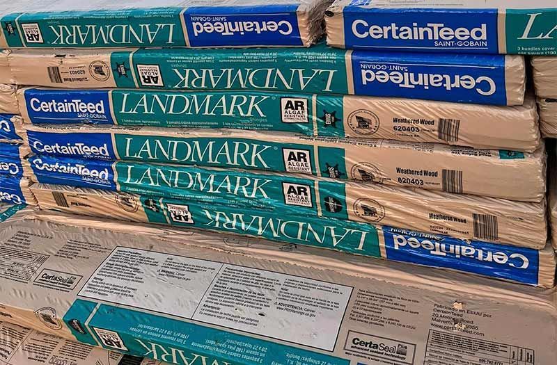 A stack of certainfeed landmark boxes on top of each other