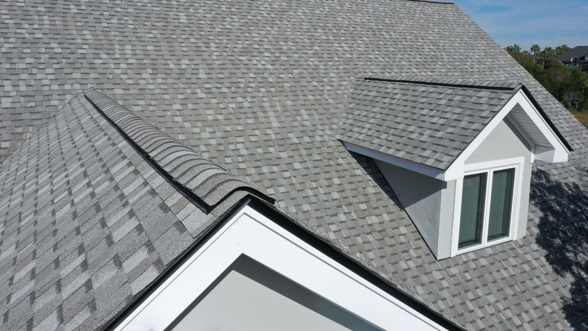 There is a window on the roof of the house.