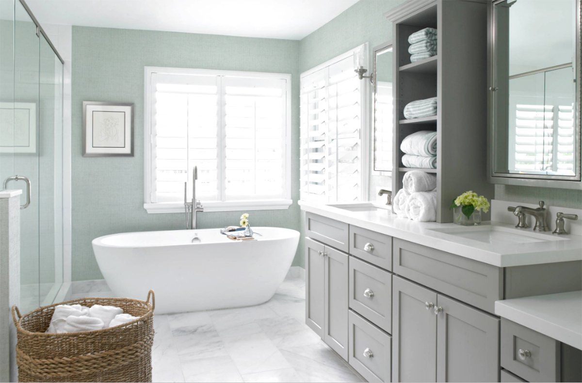 Bright, airy bathroom with a freestanding tub, double vanity, and mint green walls