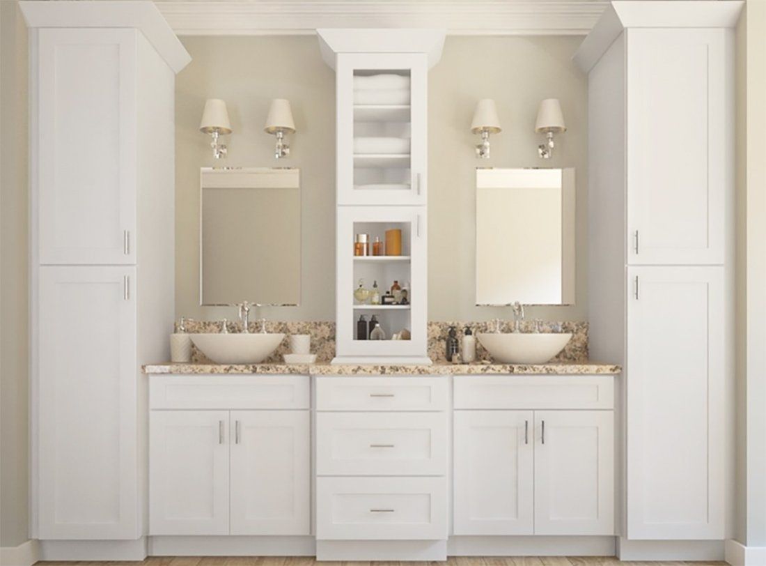 Elegant double-sink bathroom vanity in white with mirrors, sconces, and built-in shelving.