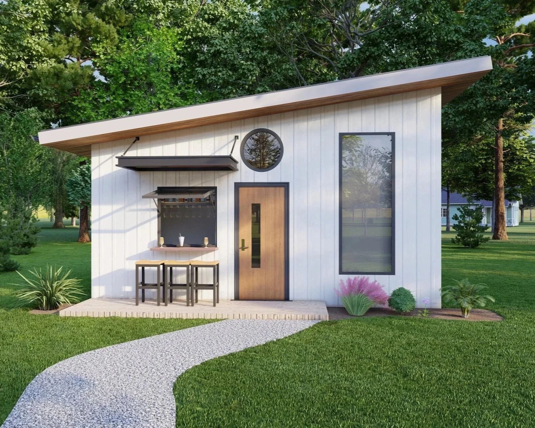 Small white modern cabin with porch, large window, and winding path in a green yard