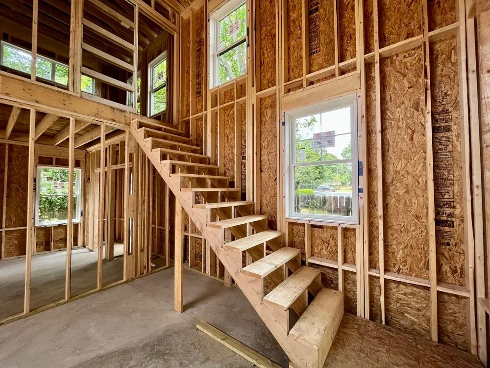 Interior of unfinished wooden staircase in a framed house under construction