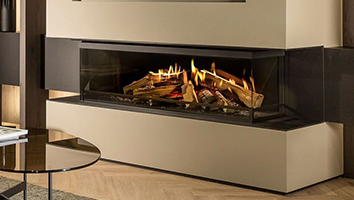 A living room with a fireplace and a coffee table.