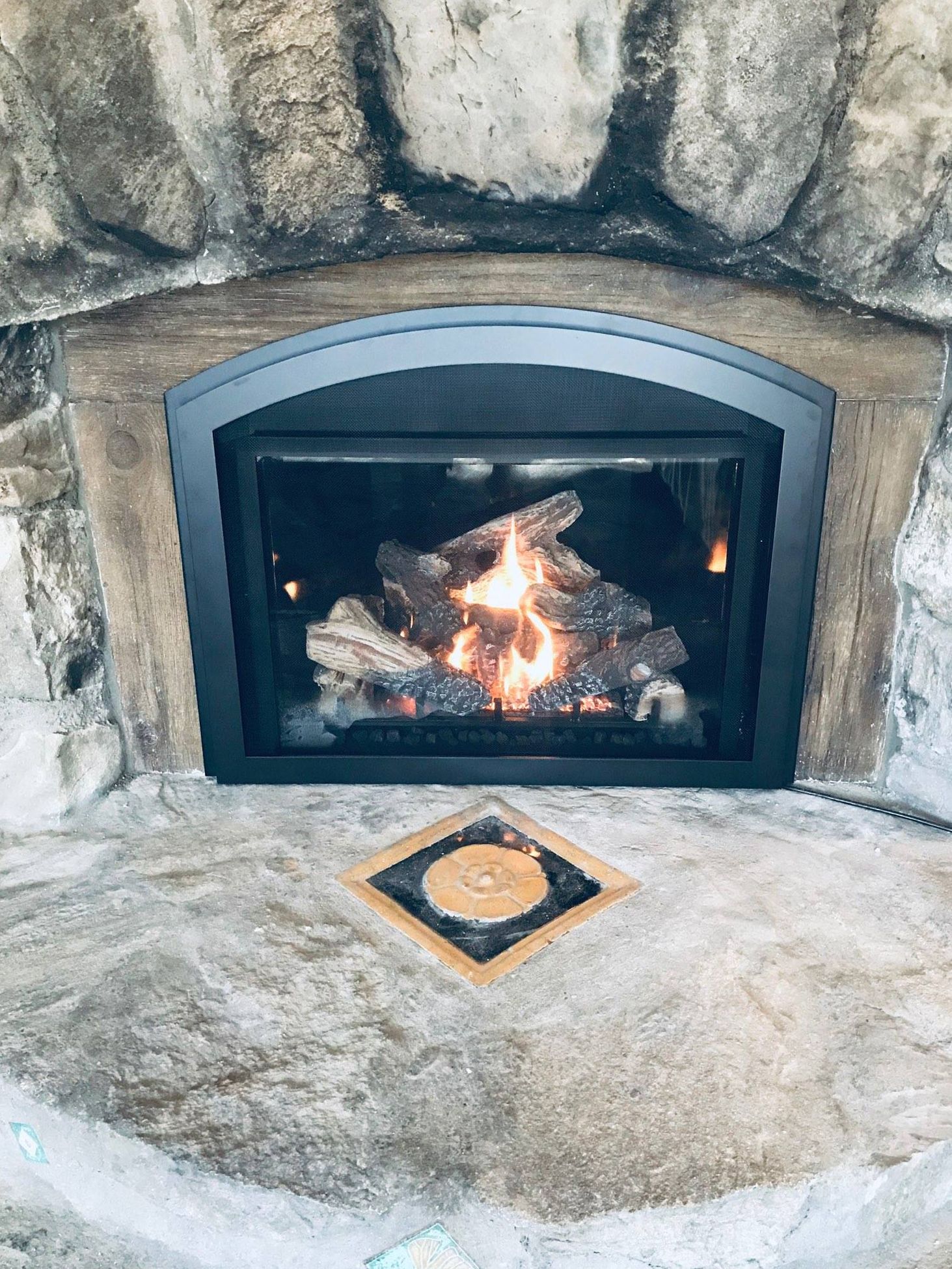 A fireplace using wood.
