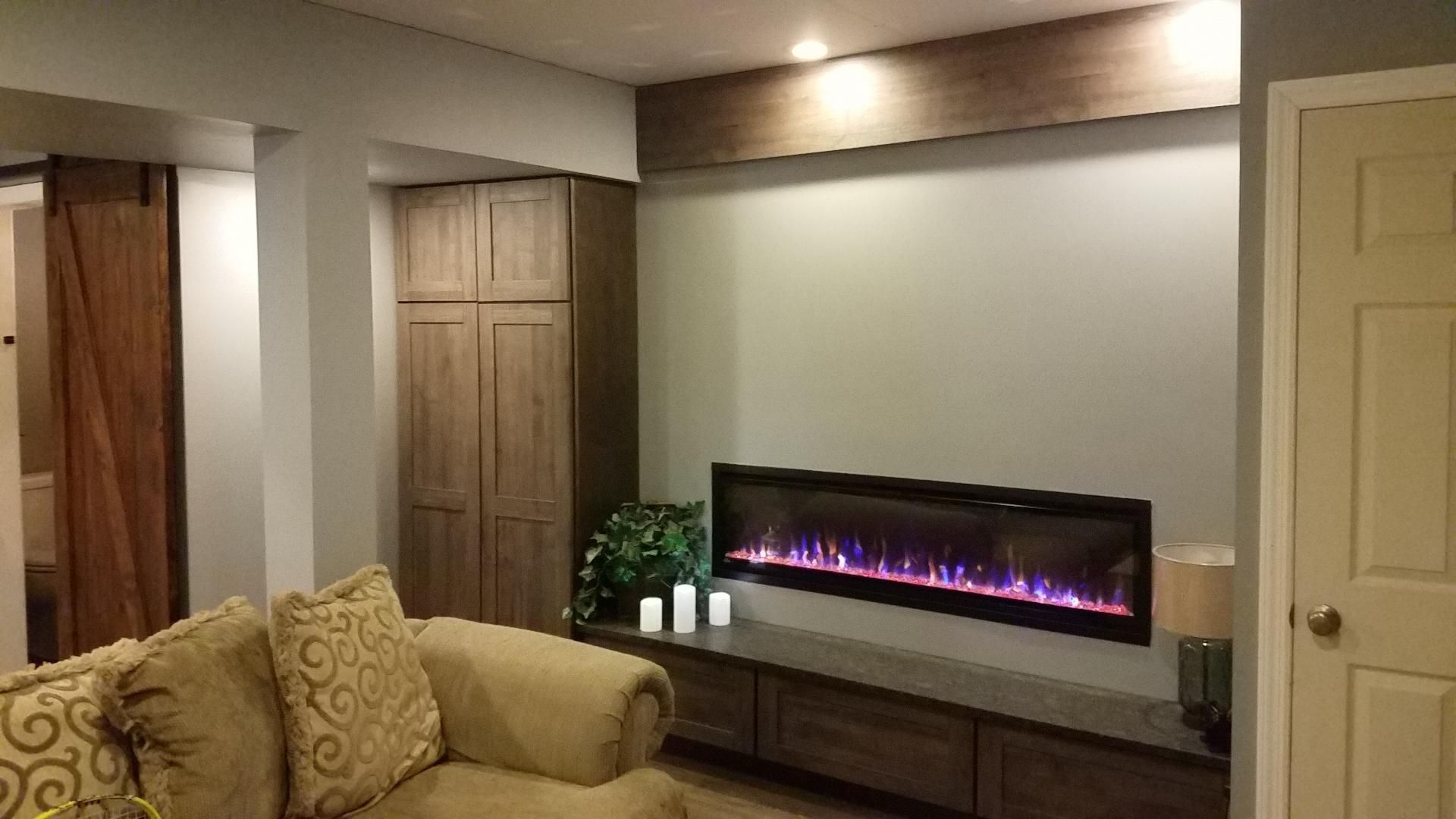 A living room with a fireplace and a couch.