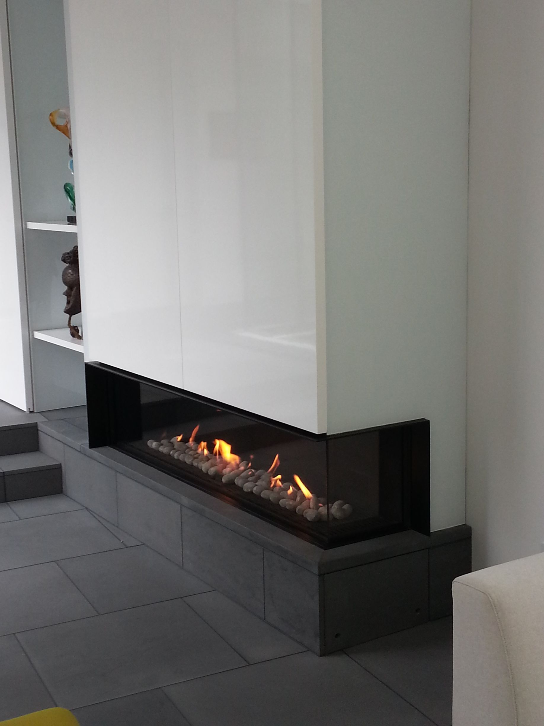 A fireplace is built into the wall in a living room.