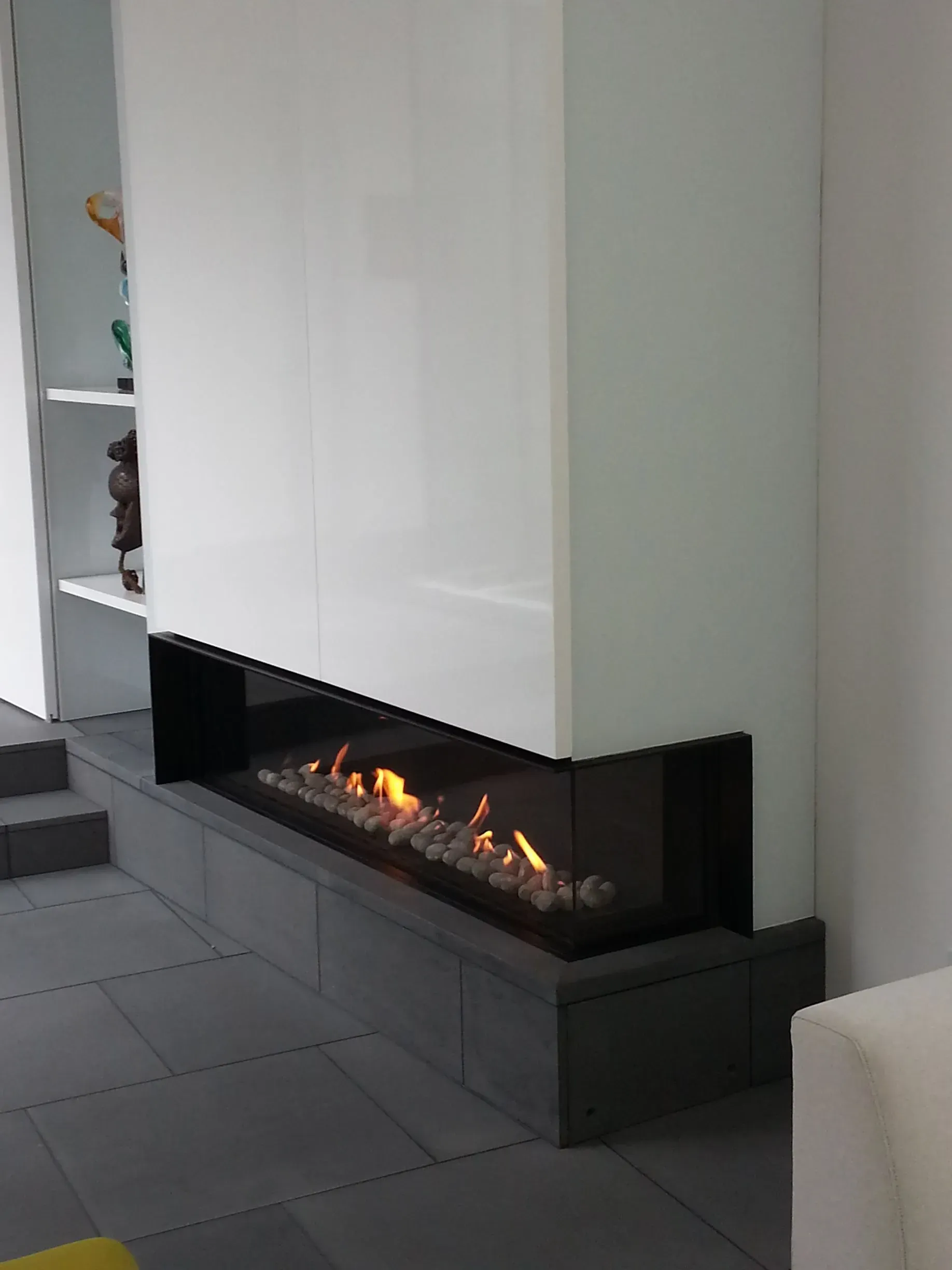 There is a fireplace in the middle of the room.