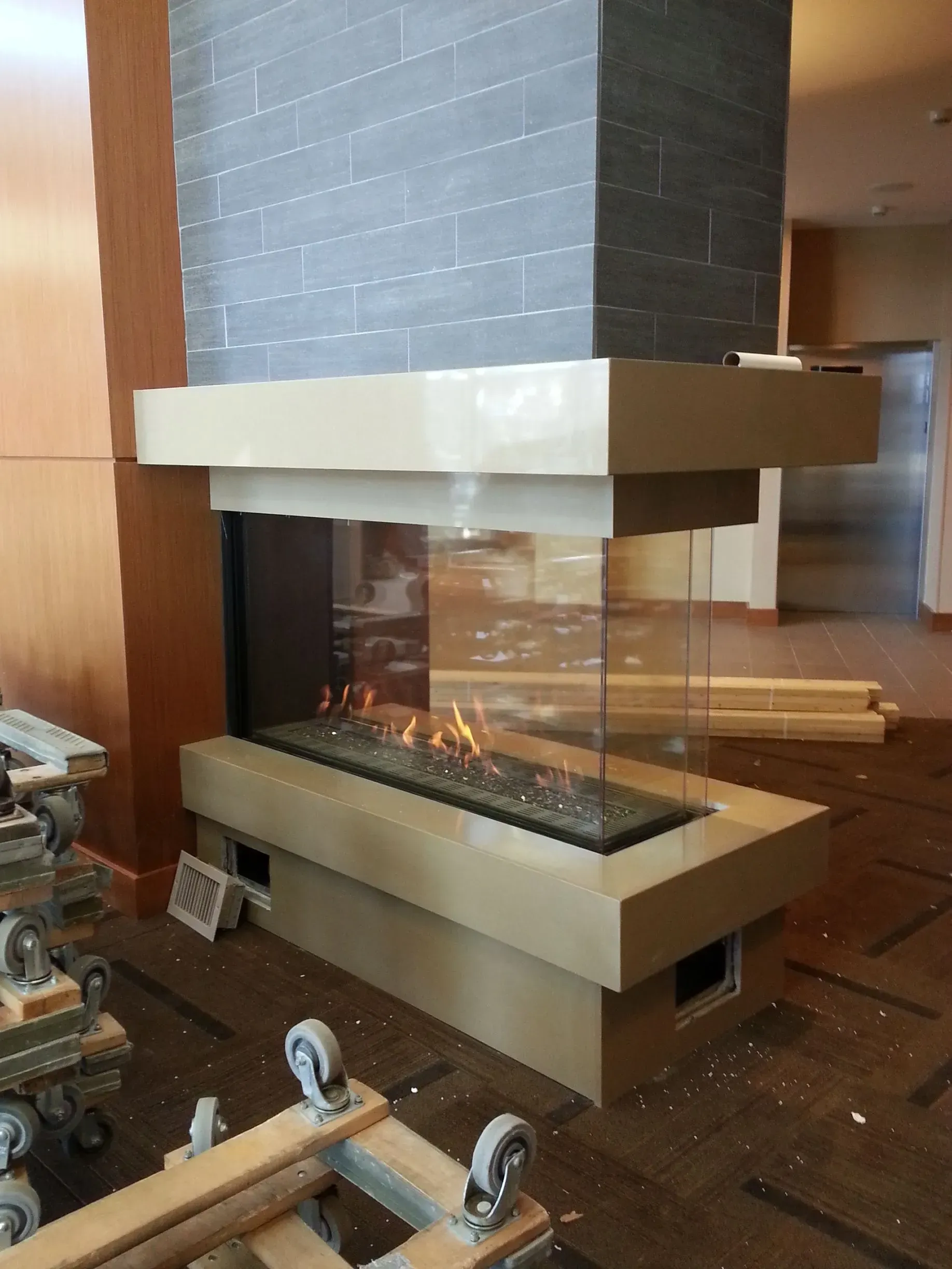 A fireplace is being built in a living room