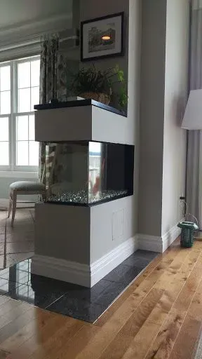 There is a fireplace in the middle of the room.