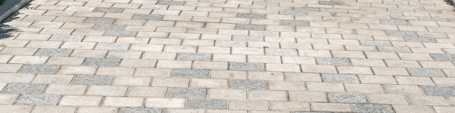 Overhead shot of a roof with light and dark gray shingles.