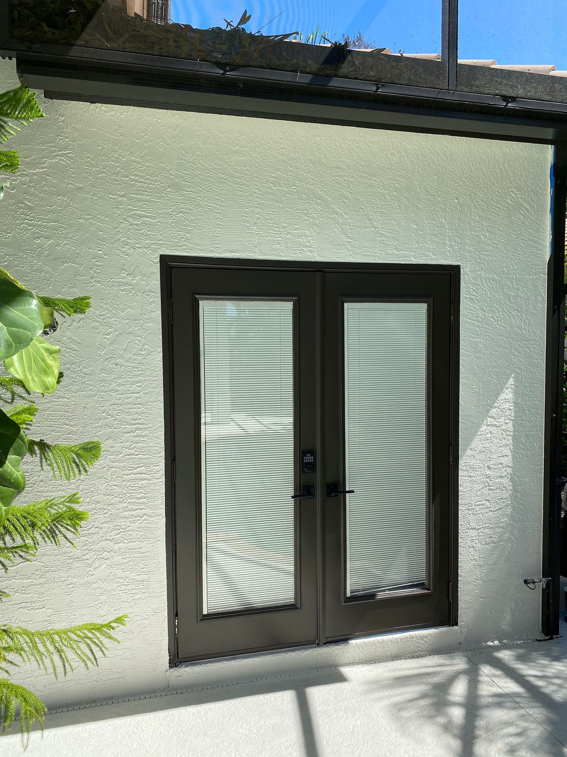 A house with a sliding glass door on the side