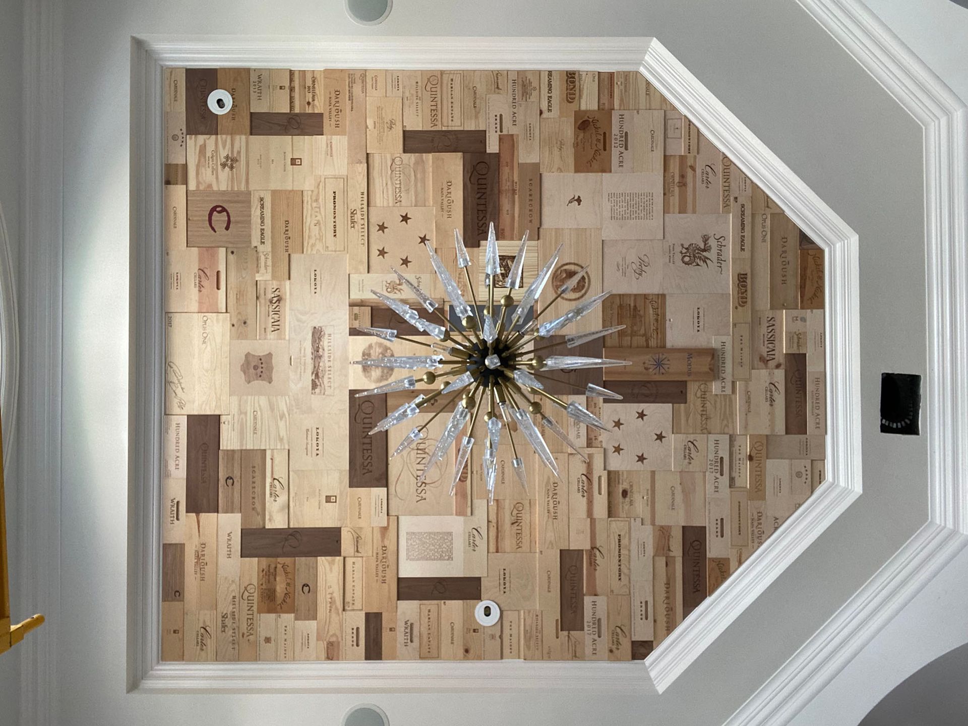 A chandelier is hanging from the ceiling of a room