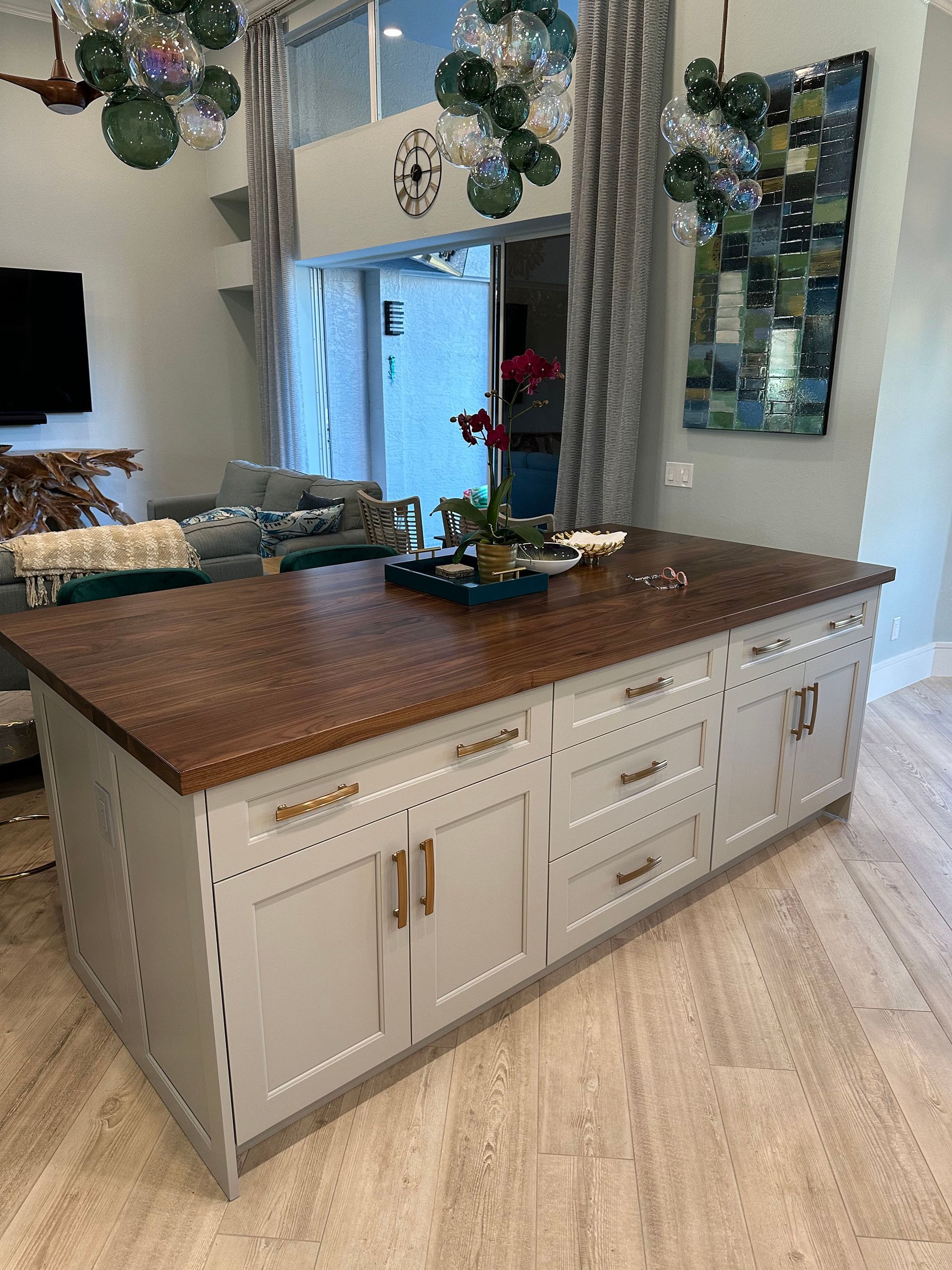 A kitchen with a large island in the middle of the room.