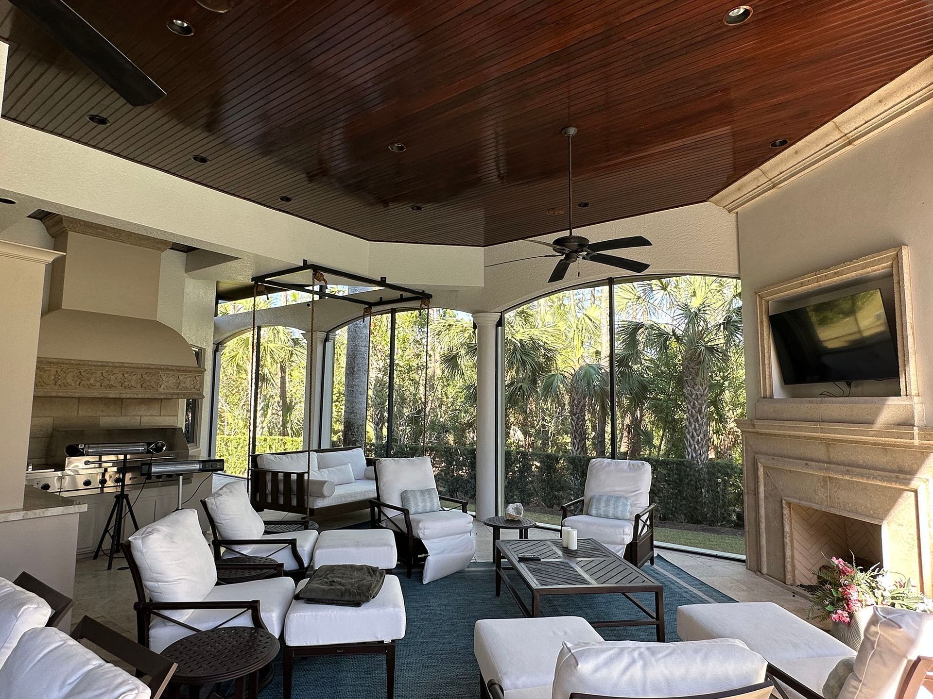 A living room with a lot of furniture and a fireplace.