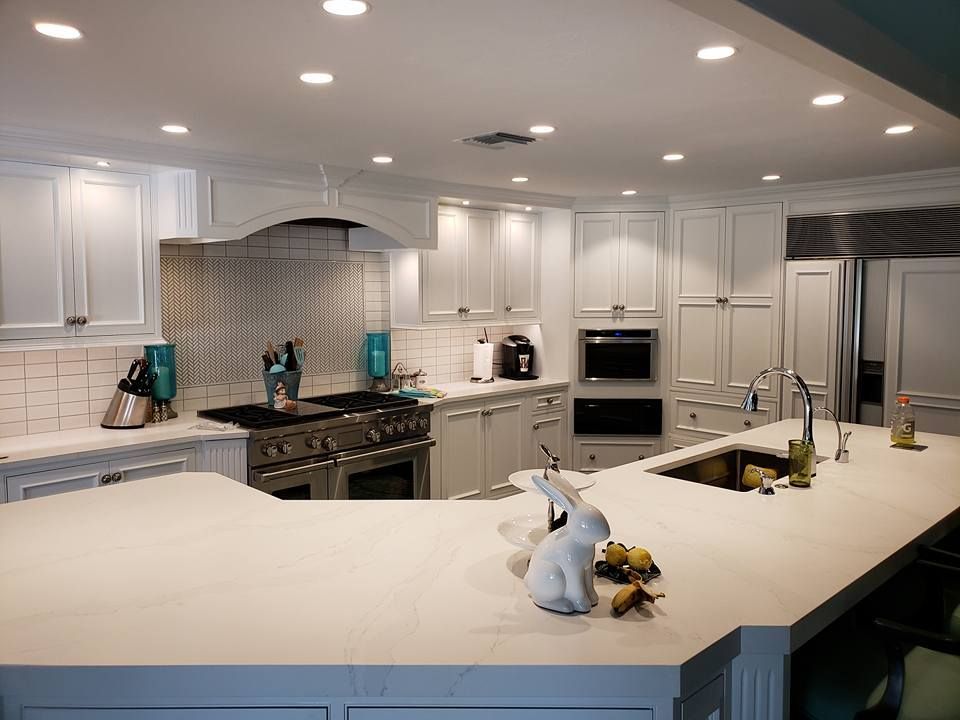 A kitchen with stainless steel appliances and wooden cabinets