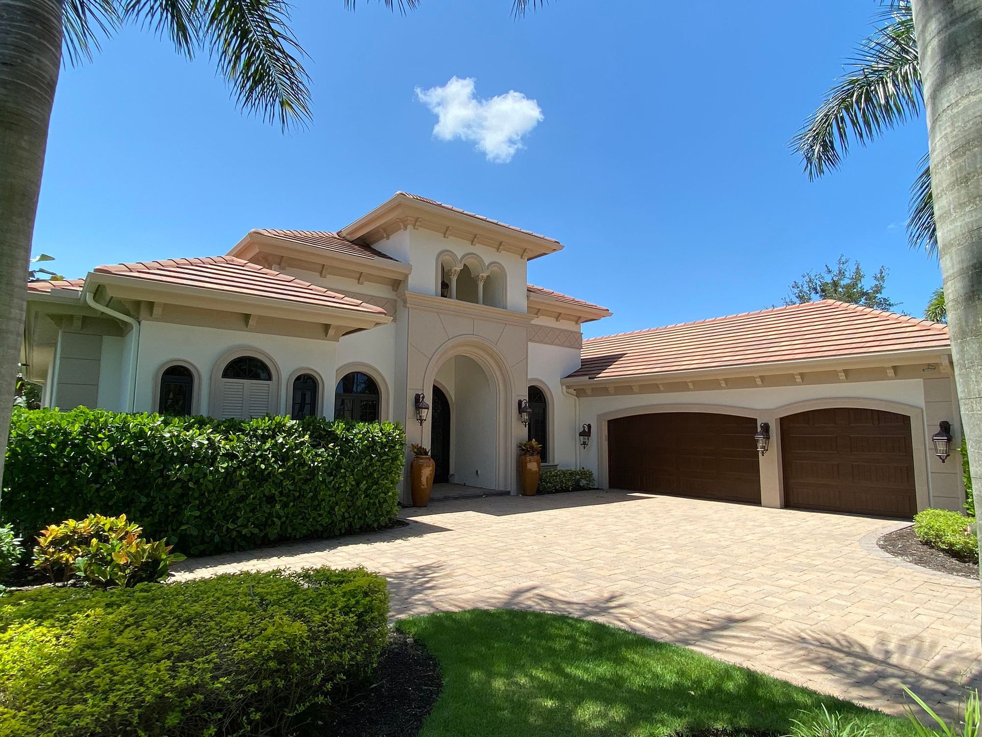 A large house with two garages and a driveway