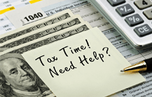 Tax forms 1040 with pen, calculator and money