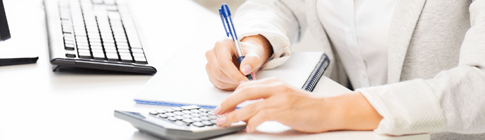 Businessman's hand financial report with pen