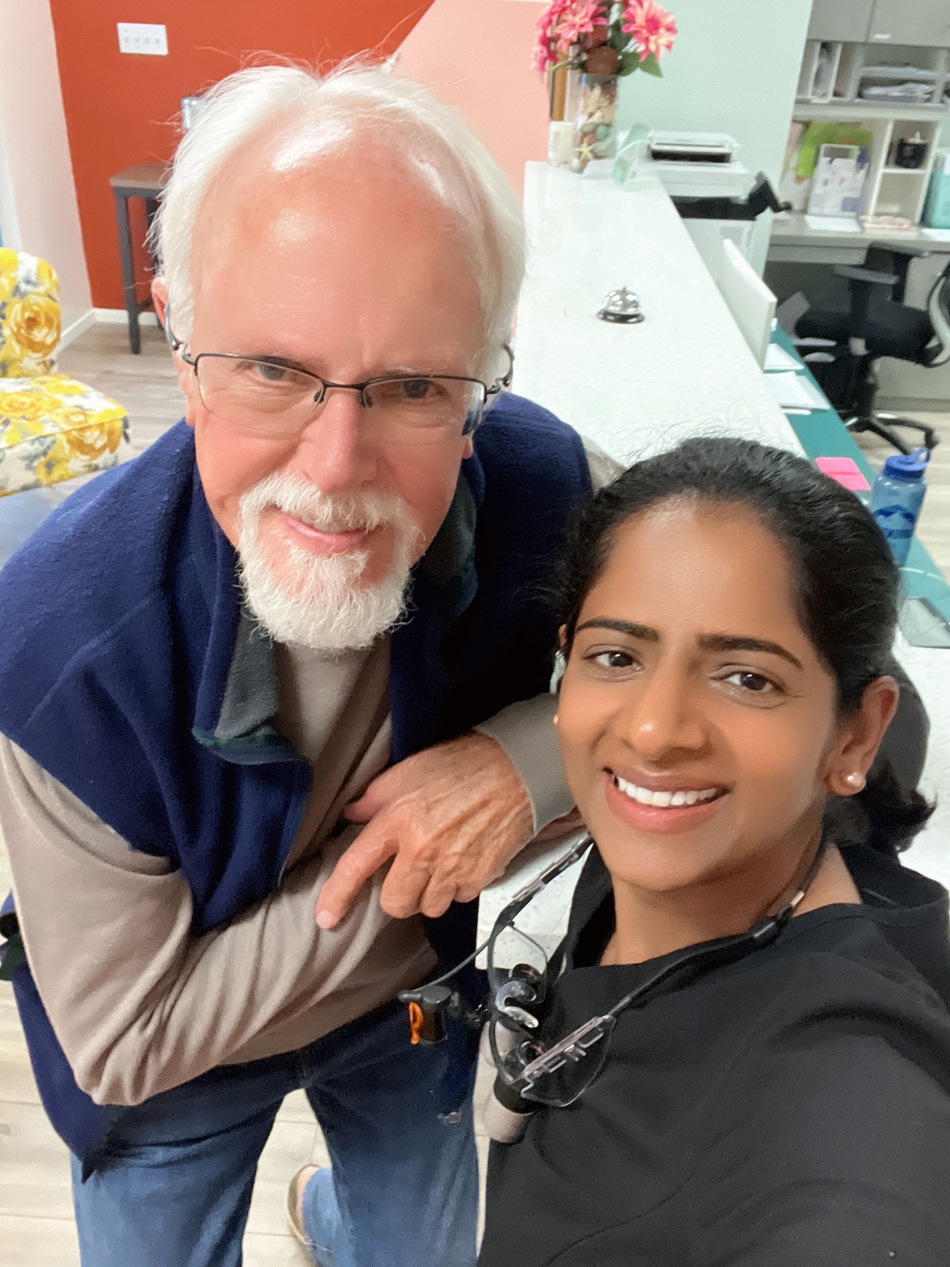 A man and a woman are posing for a picture together