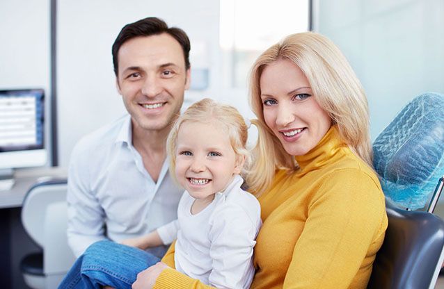 Learn More About Laser Dentistry A family is sitting in a dental chair with a little girl