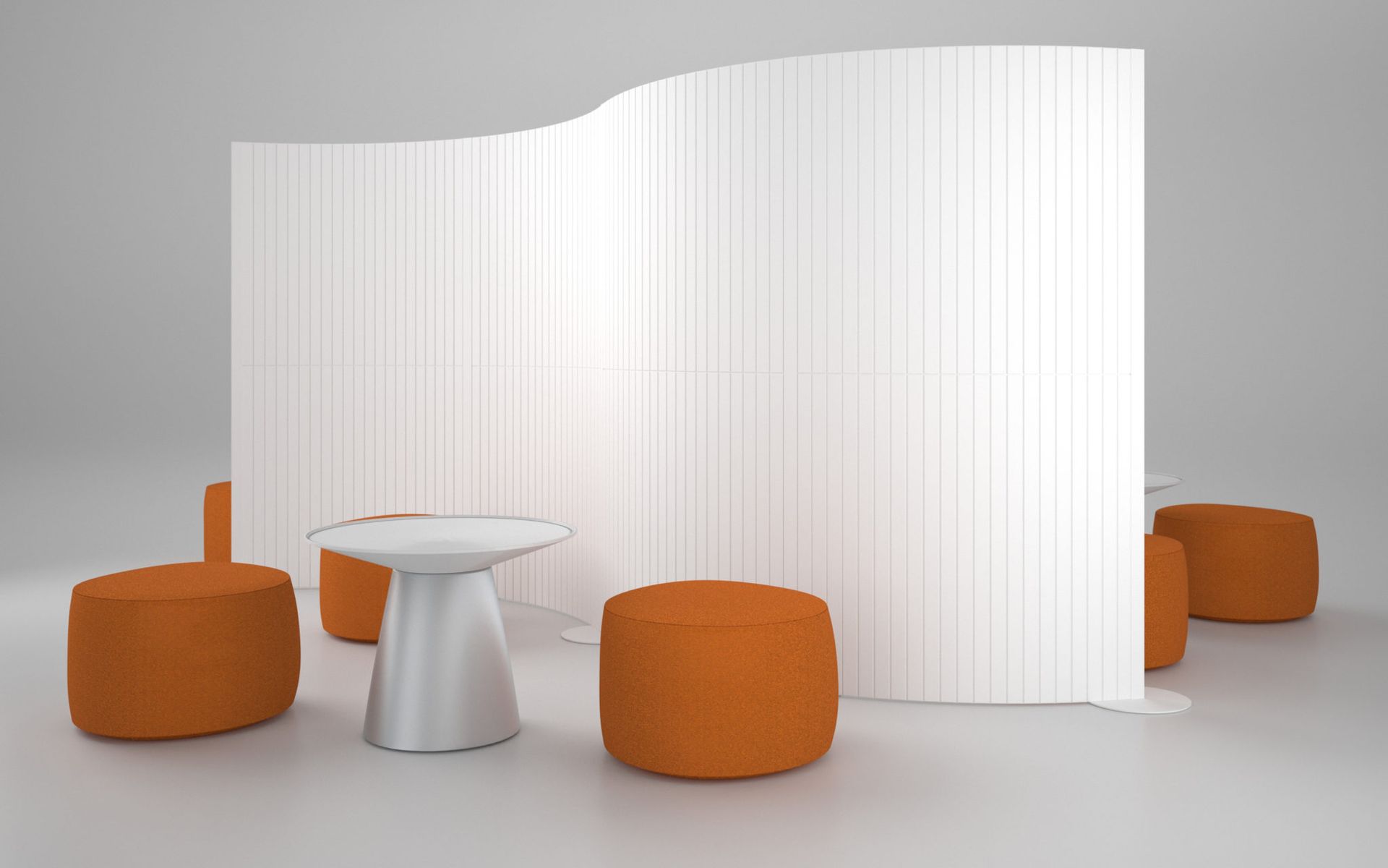 White curved wall with vertical lines, orange ottomans, and a silver table.