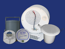 Collection of white and grey speakers, various sizes and shapes, against a blue background.