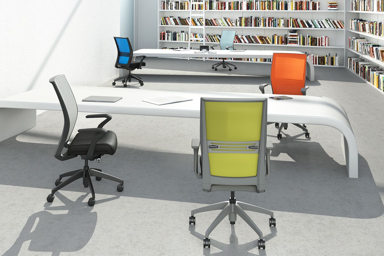 Office with multiple desks, chairs of various colors, and bookshelves filled with books.