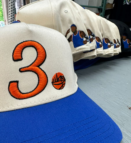 Baseball caps with a large orange 