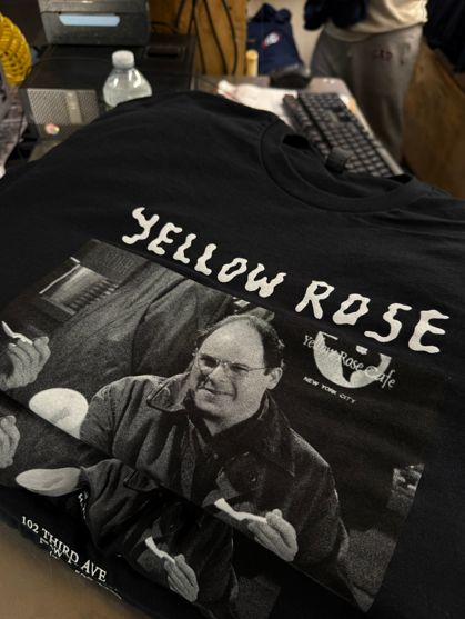 Black t-shirt with a black and white image of George Costanza from Seinfeld and the words 