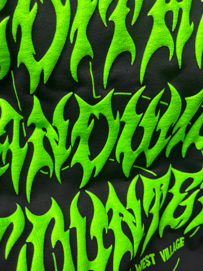 Neon green, stylized text on a black background, likely a shirt. Text includes 