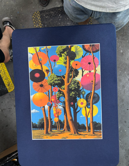 Artwork of a forest with colorful, circular “trees” against a blue sky.