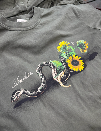 Olive green t-shirt with a graphic of a snake entwined with sunflowers, 
