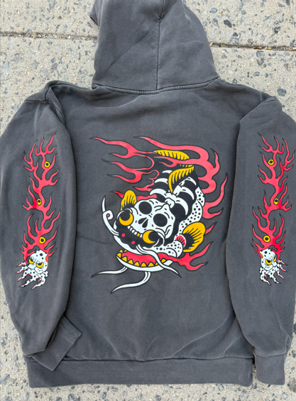 Dark gray hoodie with skull and flame design on back, red flames on sleeves.
