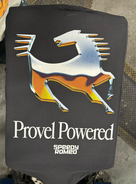 Black t-shirt with a metallic horse logo and text that reads 