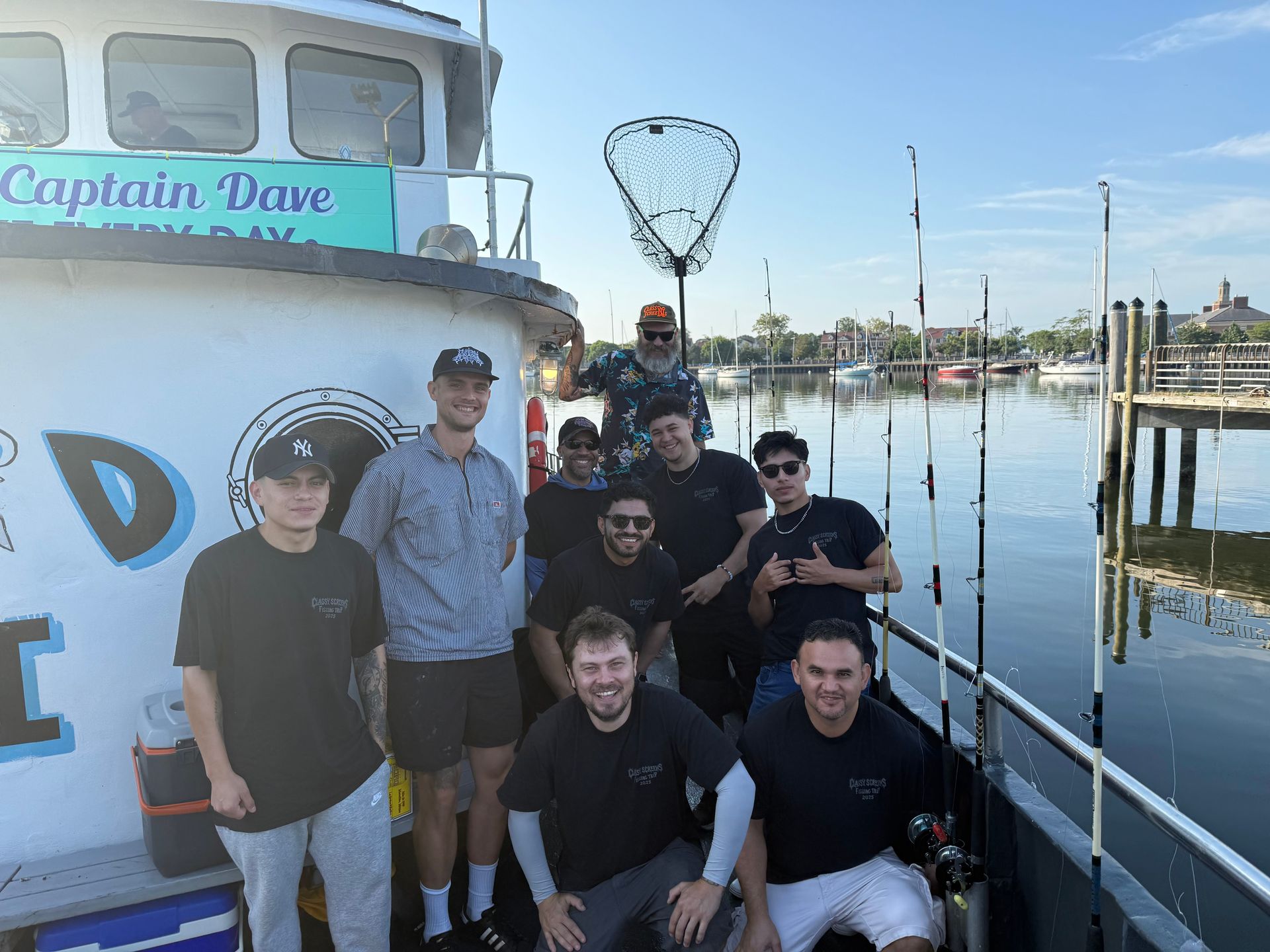 Automated t-shirt screen printing machine in operation; a shirt is being printed.