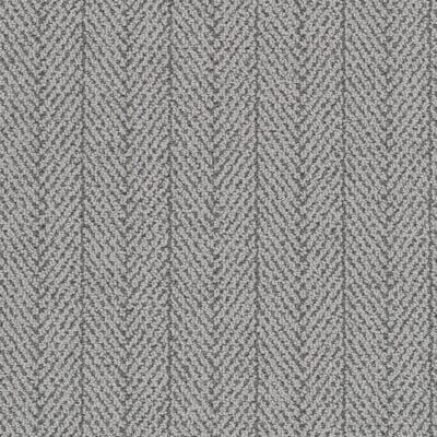 Herringbone-patterned carpet in shades of gray.