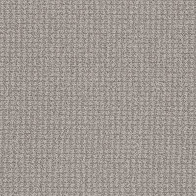 Close-up view of textured, gray carpet with a woven pattern.
