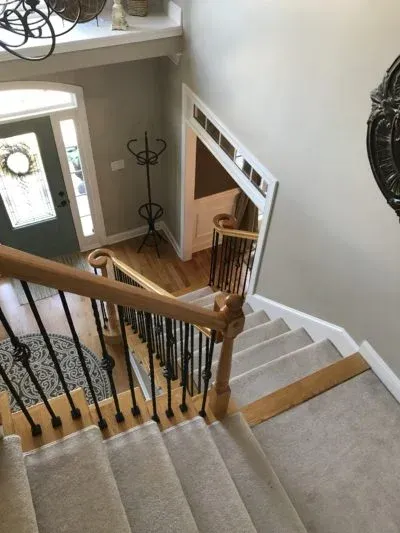 Living room with wooden staircase