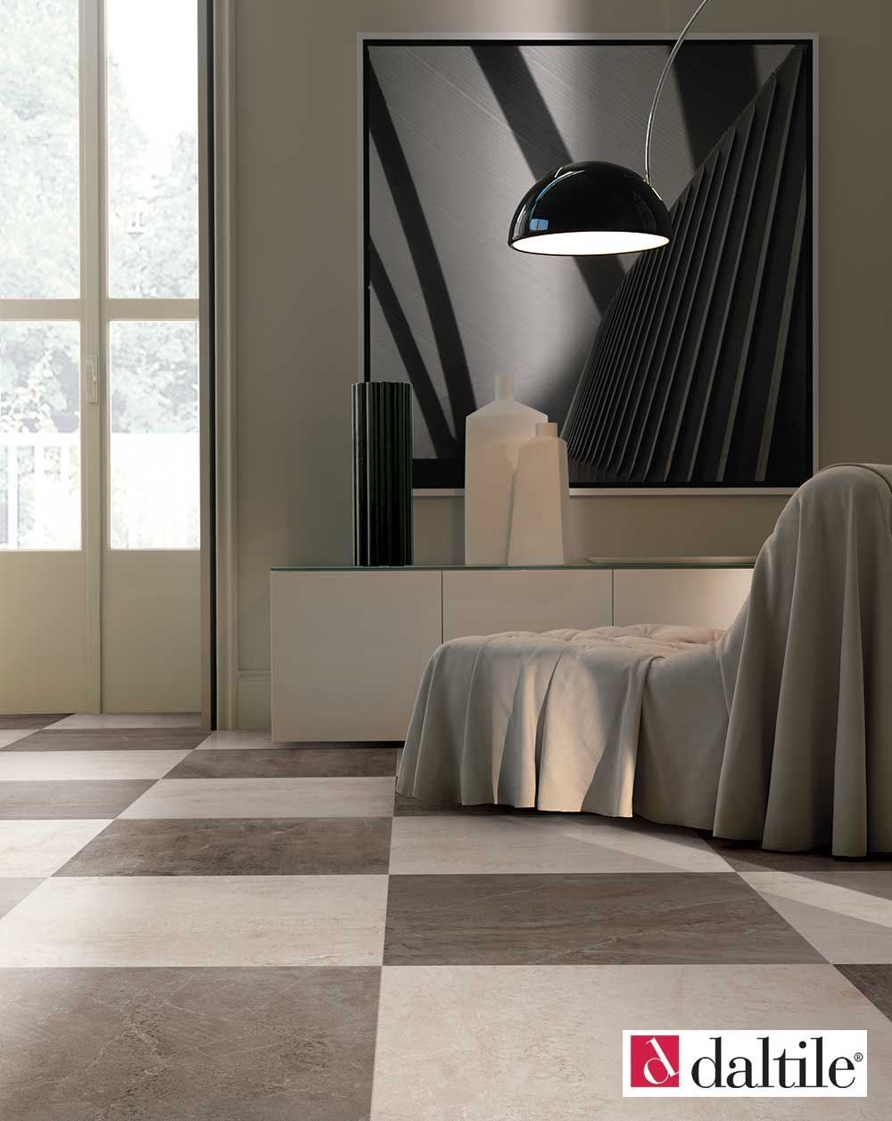 Checkered floor in room with modern decor; art, credenza, and hanging lamp.