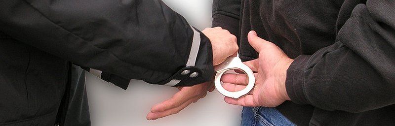 Police handcuffing a criminal