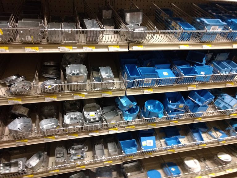 A store shelf filled with lots of blue and silver items