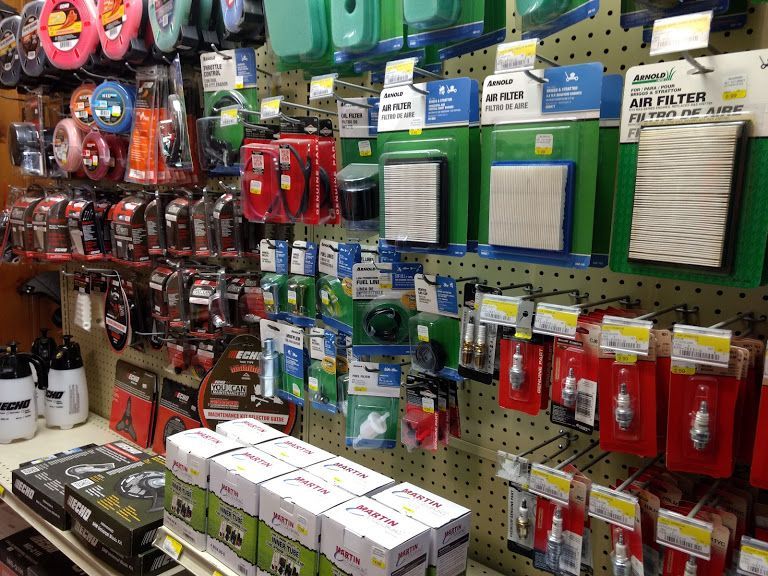 A store shelf filled with a variety of items including air filters