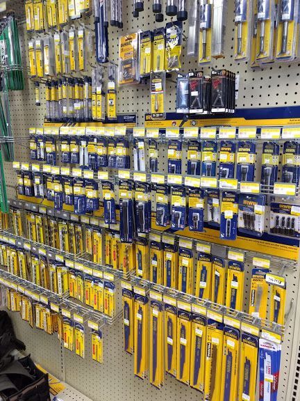 A wall filled with lots of tools and batteries