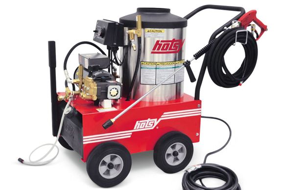 Red and silver Hotsy pressure washer on wheels with a black hose and nozzle.