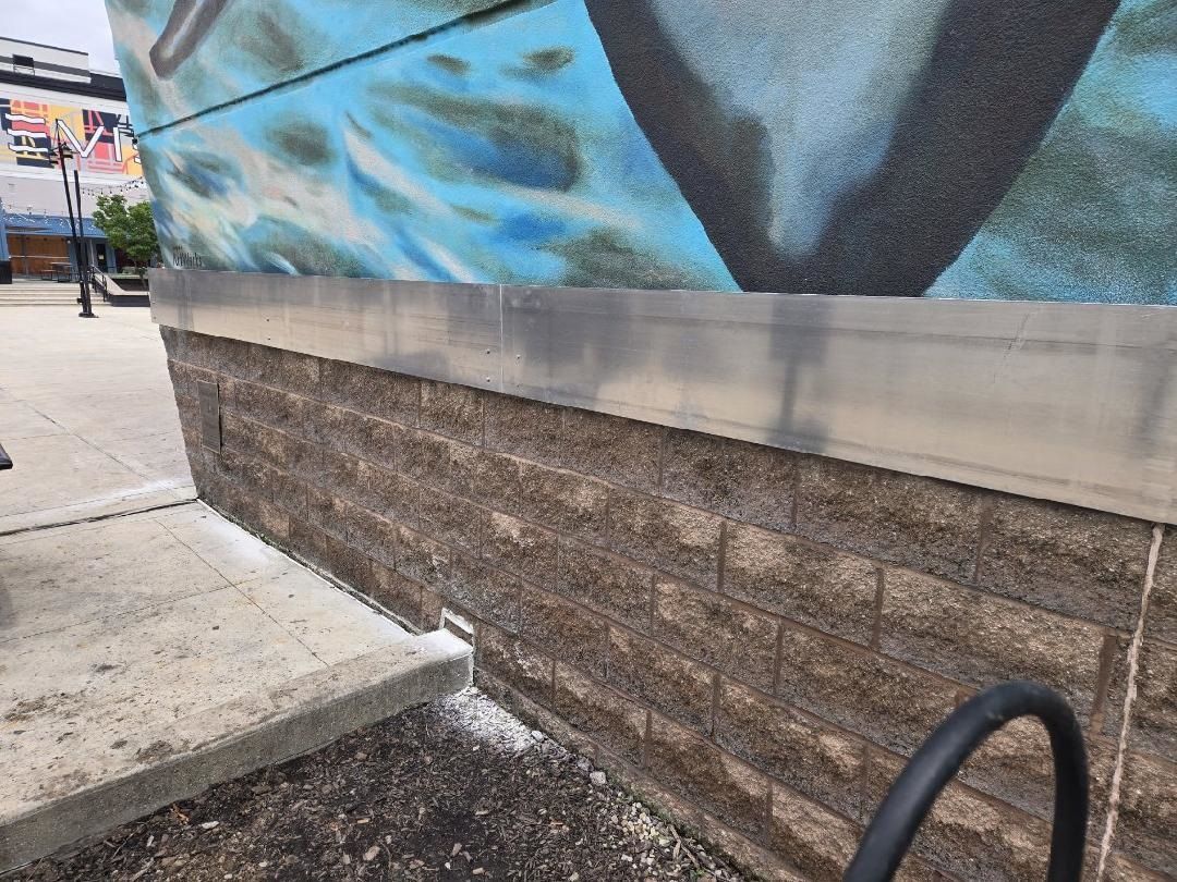 The side of a building equipped with installed lighting.