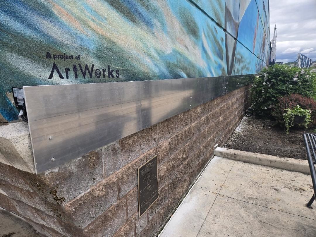 The side of a building with lighting installed.